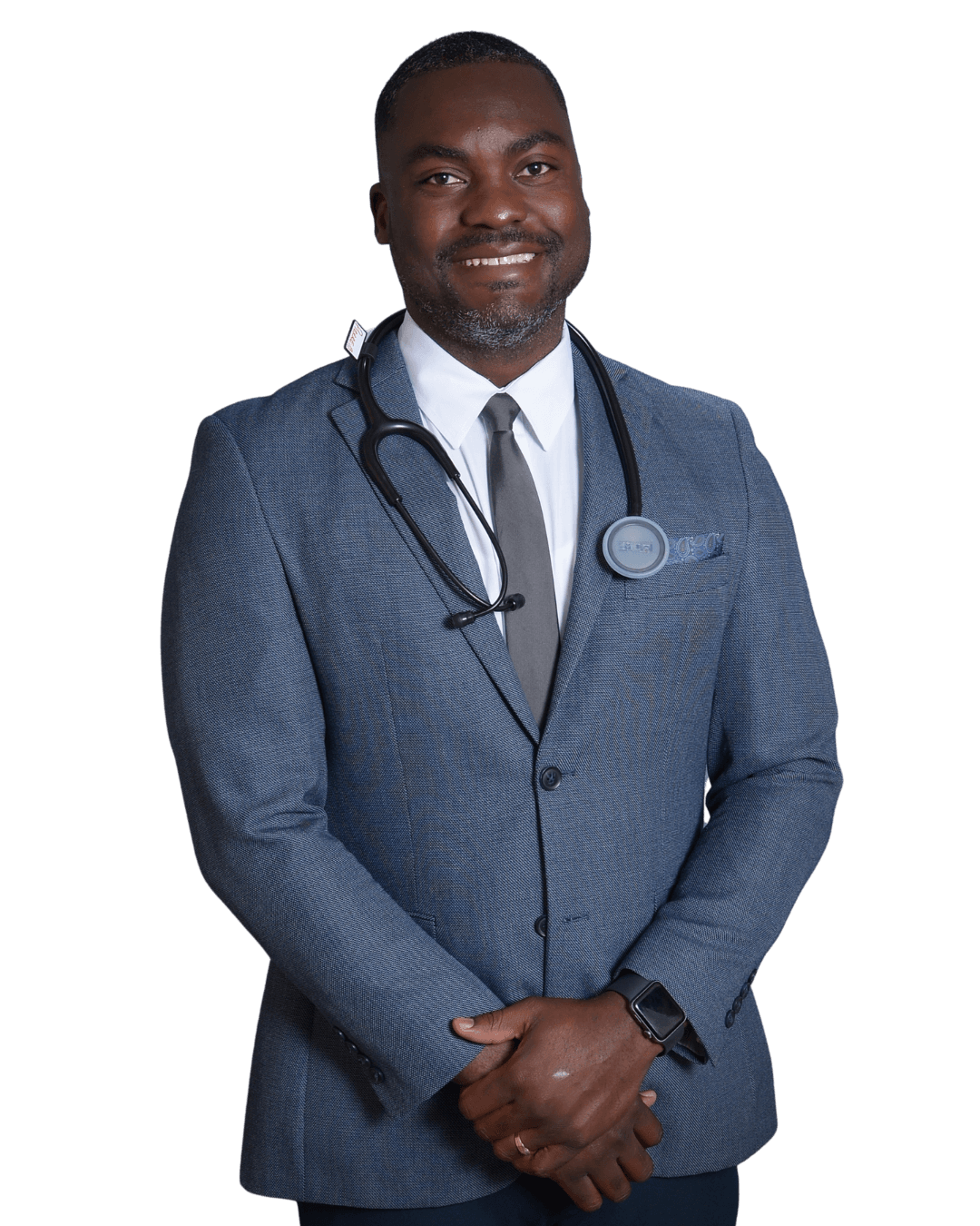 Pierre Beauge, BSN, RN, standing in a grey blazer with a stethoscope around his neck